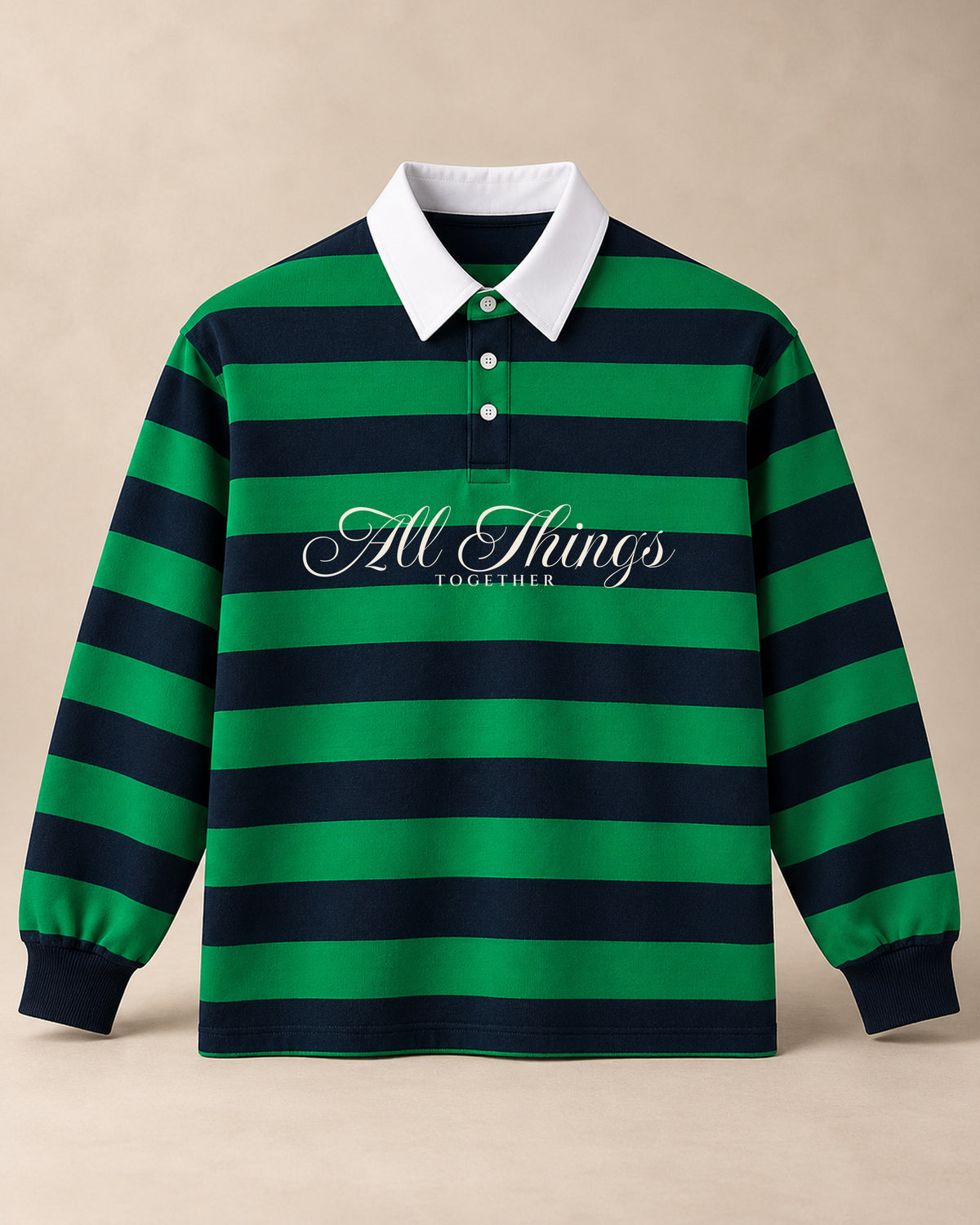 Green and navy ALL THINGS TOGETHER rugby polo, front studio view with ivory calligraphy