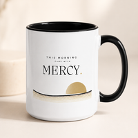 This Morning Came With Mercy Christian mug with black handle and muted gold sunrise design