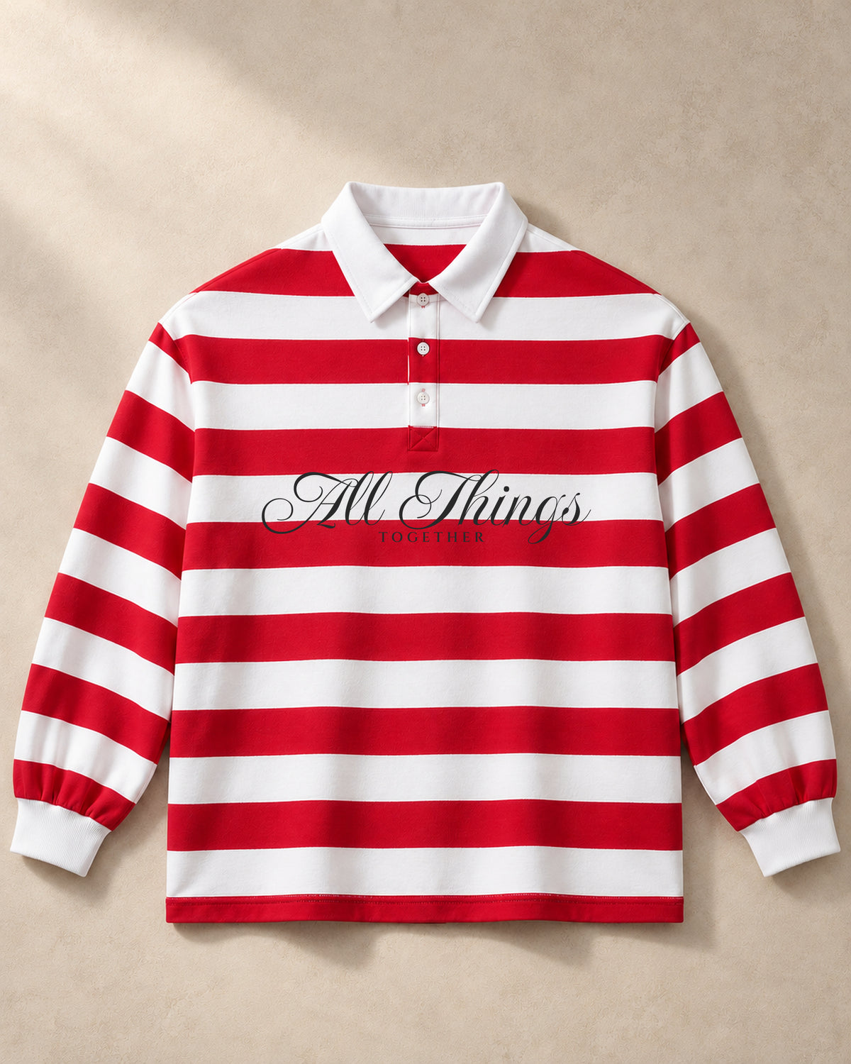 Red and white ALL THINGS TOGETHER rugby polo, front studio view with charcoal calligraphy
