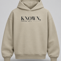 Stone KNOWN. structured heavyweight hoodie front with charcoal Isaiah 43:1 chest artwork, no pockets and no drawstrings.