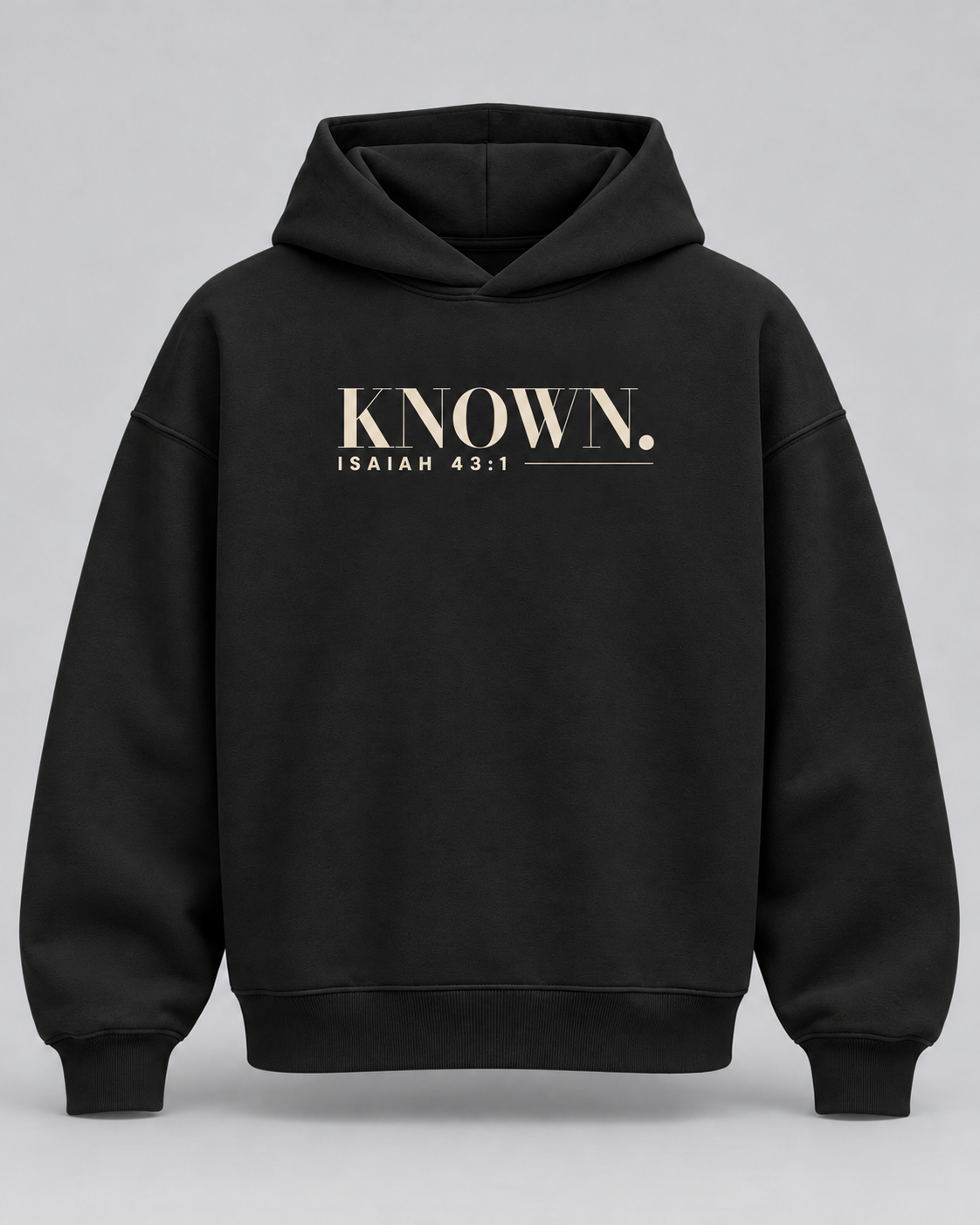 Black KNOWN. structured heavyweight hoodie front with warm ivory Isaiah 43:1 chest artwork, no pockets and no drawstrings.