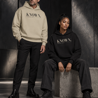 Couple styled in Stone and Black KNOWN. heavyweight hoodies with clean pocketless fronts and no drawstrings.