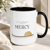 Close-up of Mercy typography and muted gold dawn artwork on Christian ceramic mug