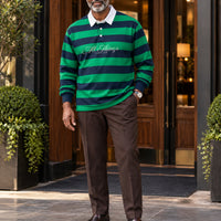 Green and navy rugby polo styled with chocolate tailored trousers and leather loafers