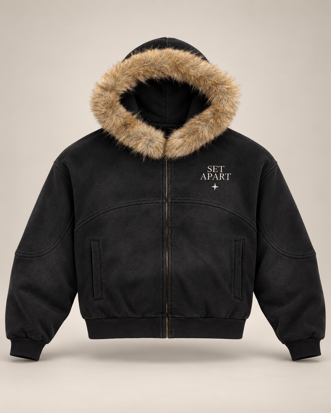 Studio rendering of SET APART sun-faded black boxy zip hoodie with tan faux-fur hood trim and restrained bone left-chest print