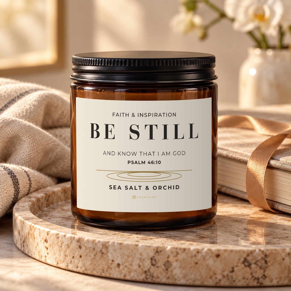 828 Creations BE STILL Psalm 46:10 Sea Salt & Orchid candle in a premium gifting scene.