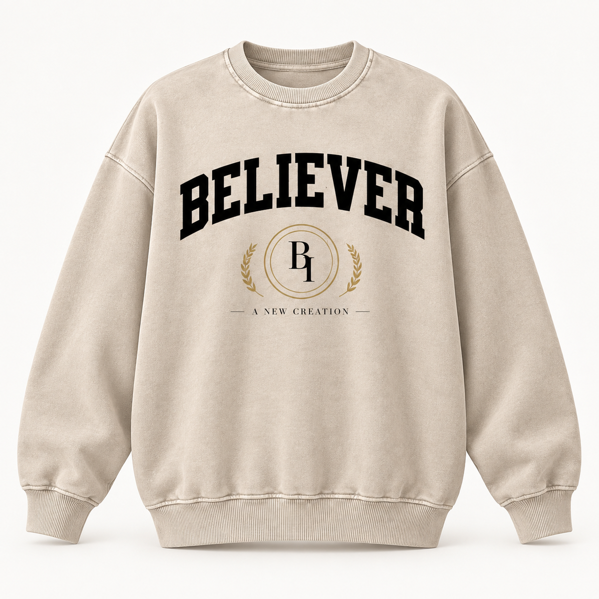 Front view of the BELIEVER IDENTITY Snow Washed Oversized Sweatshirt in Light Apricot with collegiate graphic