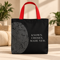Black Believer Identity large tote with red handles, oversized fingerprint artwork and Known. Chosen. Made New. message