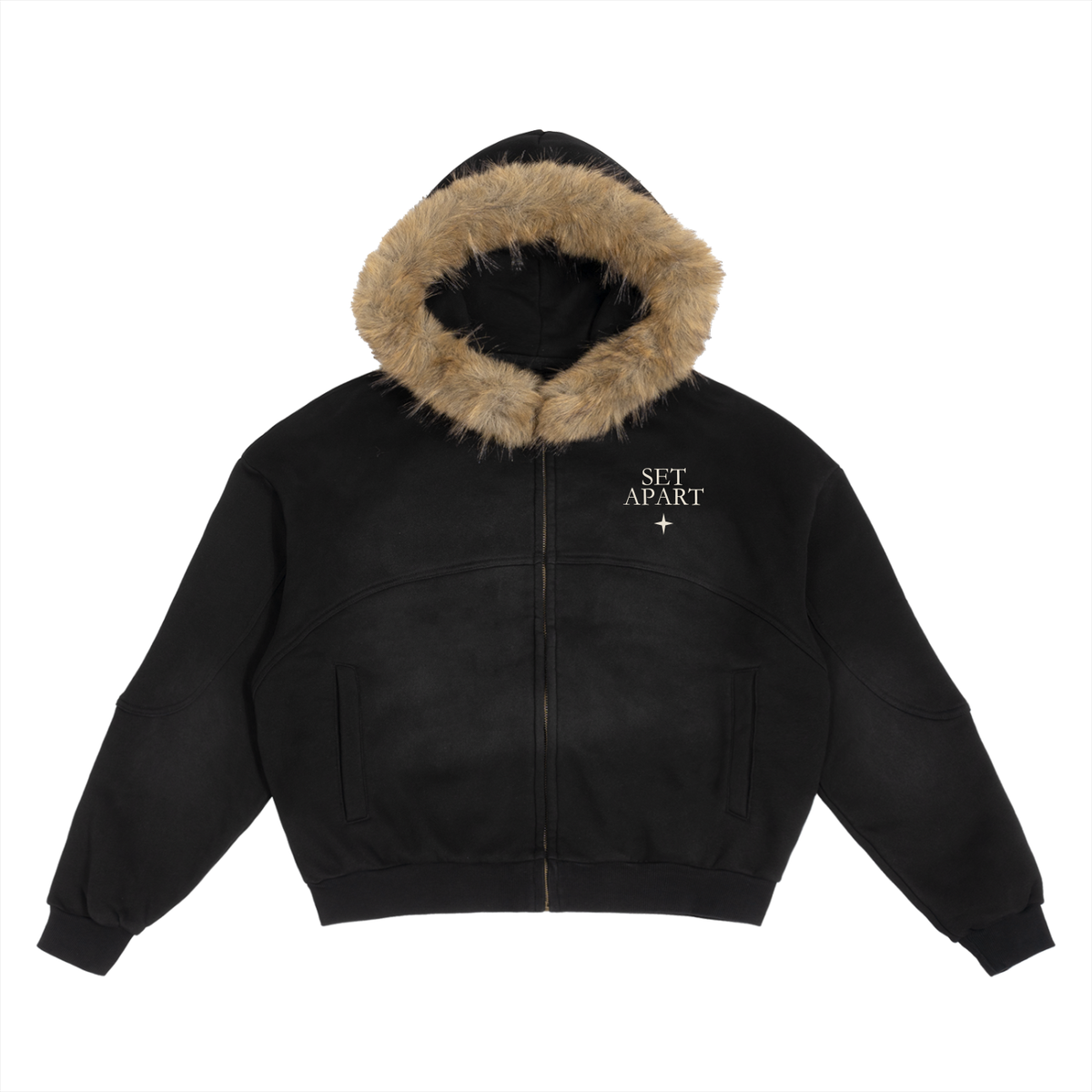 Front view of SET APART sun-faded black boxy zip hoodie with warm faux-fur hood and bone-colored left chest insignia