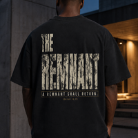 Man wearing THE REMNANT black oversized heavyweight T-shirt showing the distressed Isaiah 10:21 back graphic
